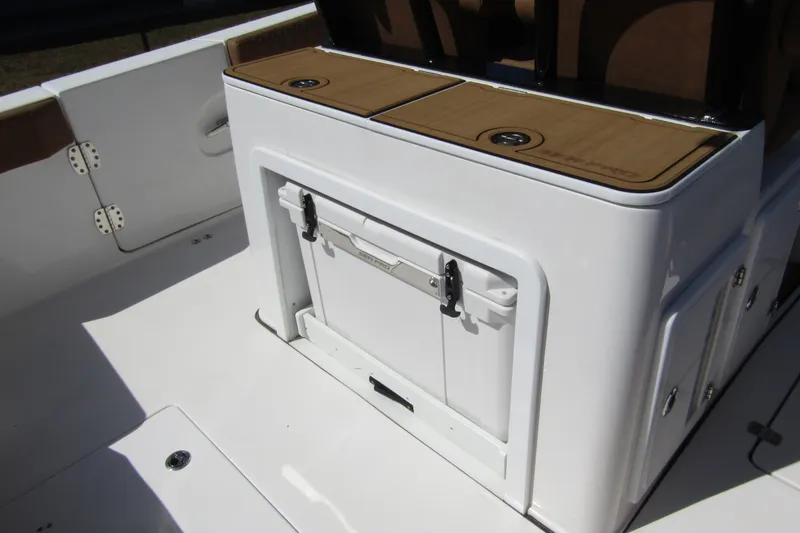 Slide: The Image of 2025 Sea Pro 322 Offshore boat interior with storage compartment and seating. - 38