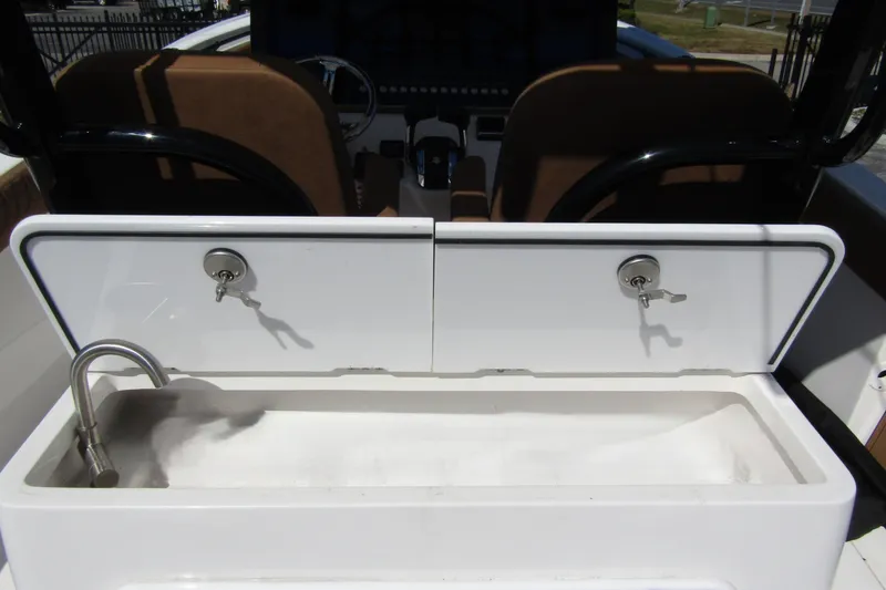 Slide: The Image of 2025 Sea Pro 322 Offshore boat interior with sink and storage compartments. - 40