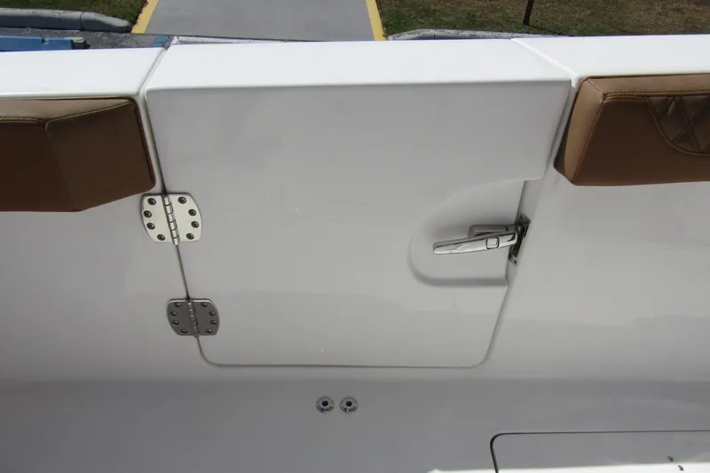Slide: The Image of 2025 Sea Pro 322 Offshore boat door with brown cushions and stainless steel hinges. - 41