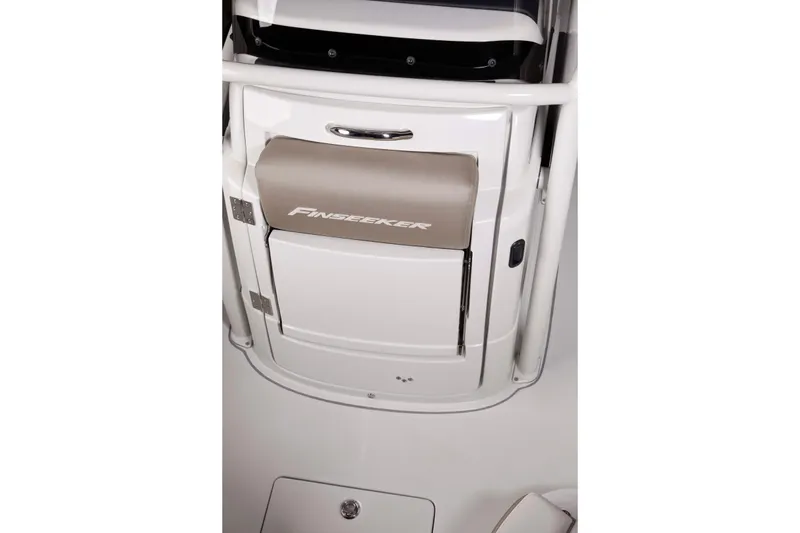 Slide: The Image of 2026 Finseeker 220 CC boat console with branded seat and storage compartment. - 11