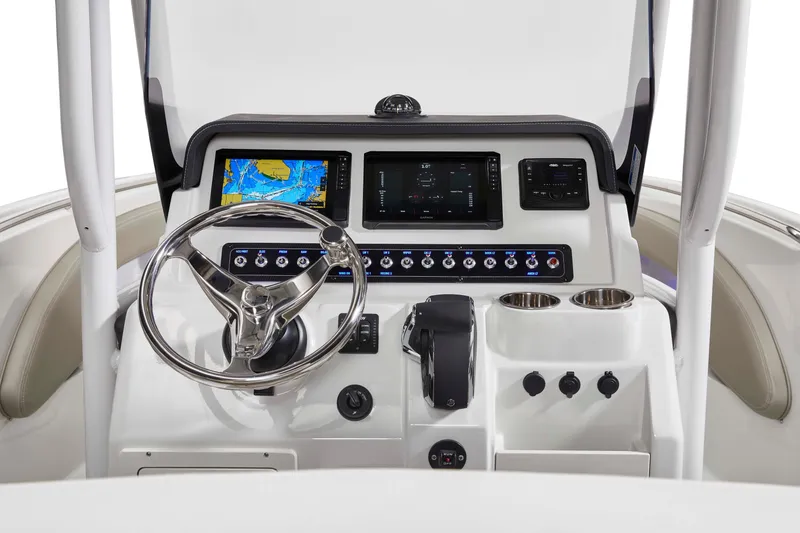 Slide: The Image of 2026 Finseeker 220 CC boat dashboard with modern controls and navigation screens. - 3