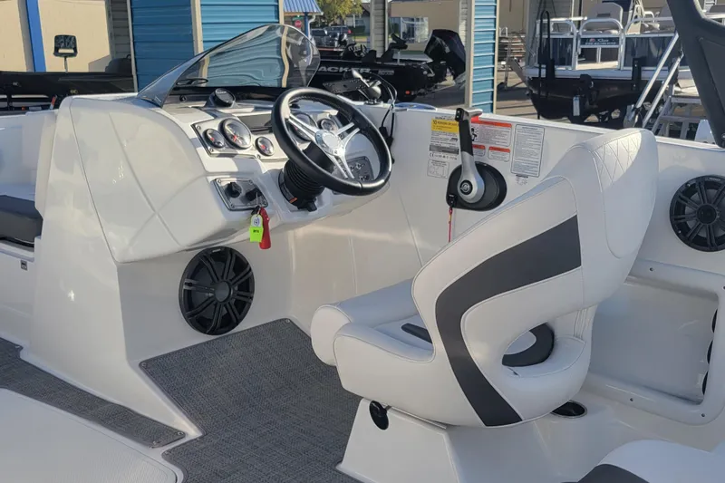 Slide: The Image of Modern Tahoe 1950 boat cockpit with steering wheel and controls, 2023 model. - 12