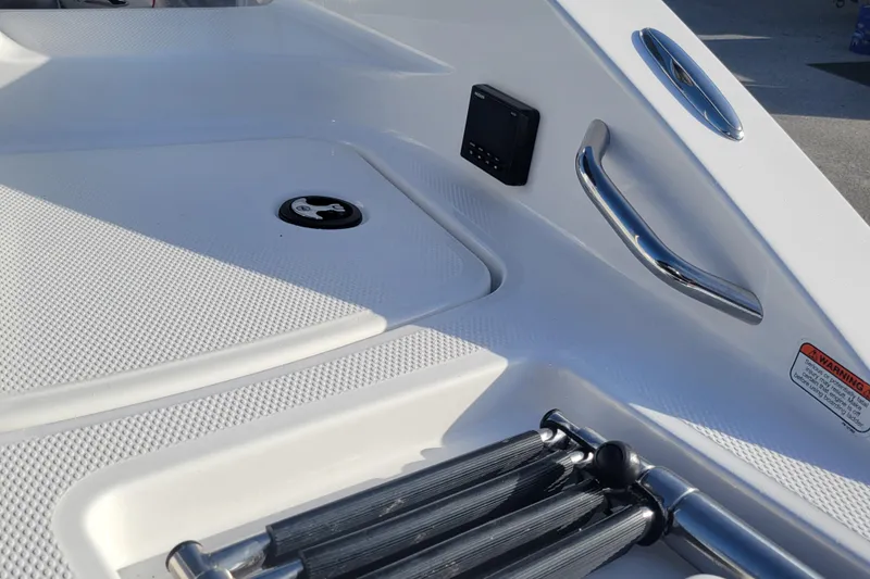 Slide: The Image of 2023 Tahoe 1950 boat deck with stainless steel handle and ladder. - 14