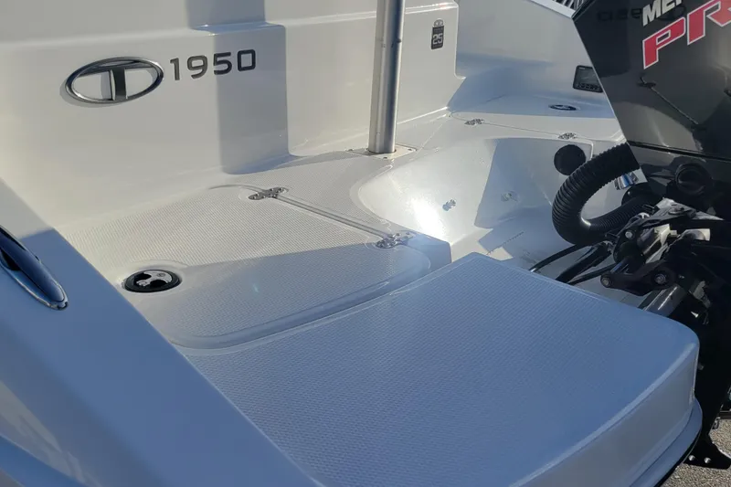 Slide: The Image of Tahoe 1950 boat deck, 2023 model, featuring sleek design and modern outboard motor. - 15