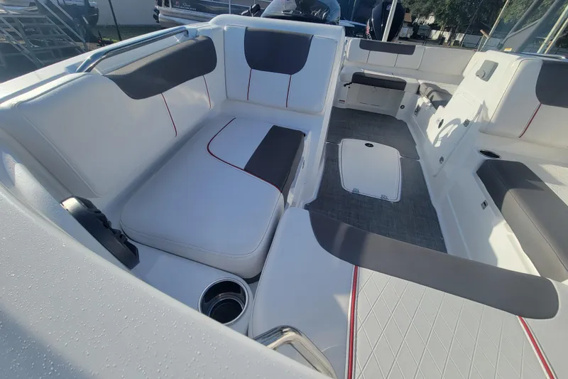 Slide: The Image of Interior of 2023 Tahoe 1950 boat with white and gray seating. - 8
