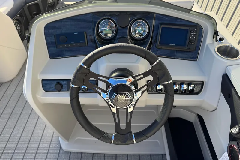 Slide: The Image of Steering console of 2026 Avalon LSZ Entertainer boat with modern controls and gauges. - 11