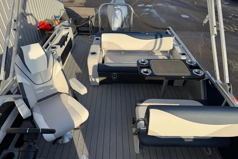 Slide: The Image of 2026 Avalon LSZ Entertainer boat interior with seating and table setup. - 12