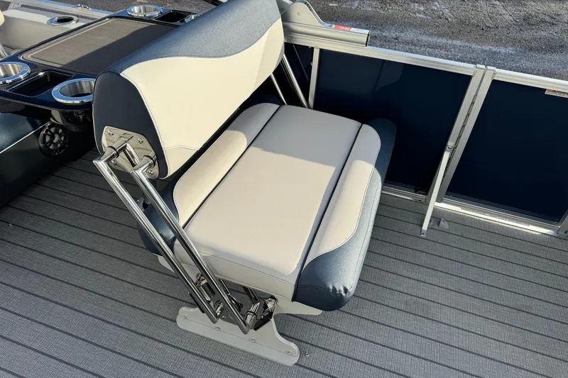 Slide: The Image of 2026 Avalon LSZ Entertainer boat seat with cup holders on deck. - 14