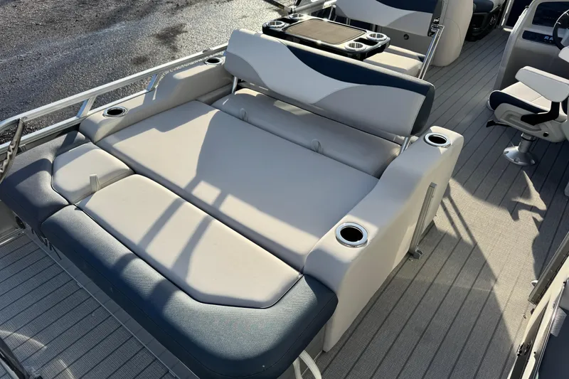 Slide: The Image of 2026 Avalon LSZ Entertainer boat interior with luxurious seating and cup holders. - 5