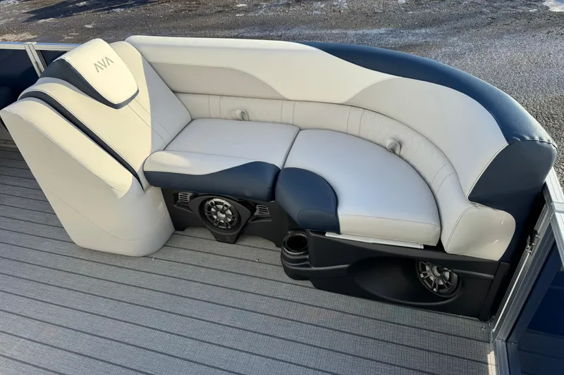 Slide: The Image of 2026 Avalon LSZ Entertainer boat seating with integrated speakers and cup holders. - 9