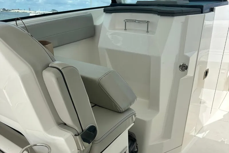 Slide: The Image of 2023 Pursuit DC 295 Dual Console interior with sleek seating and modern design. - 14