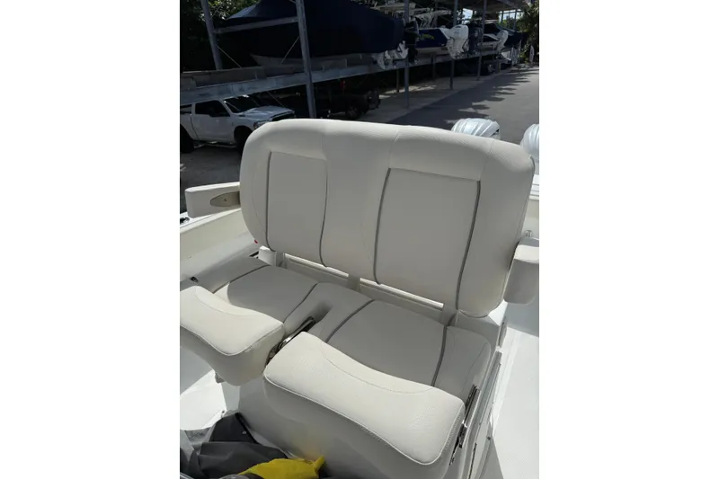 Slide: The Image of 2024 Sea Hunt Gamefish 27 Forward Seating with comfortable beige seats. - 25