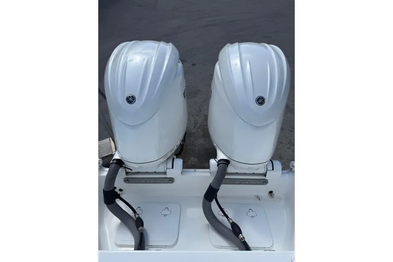 Slide: The Image of Twin outboard engines on a 2024 Sea Hunt Gamefish 27 Forward Seating boat. - 5