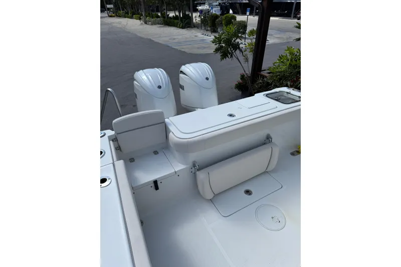 Slide: The Image of 2024 Sea Hunt Gamefish 27 boat with forward seating and dual engines. - 6