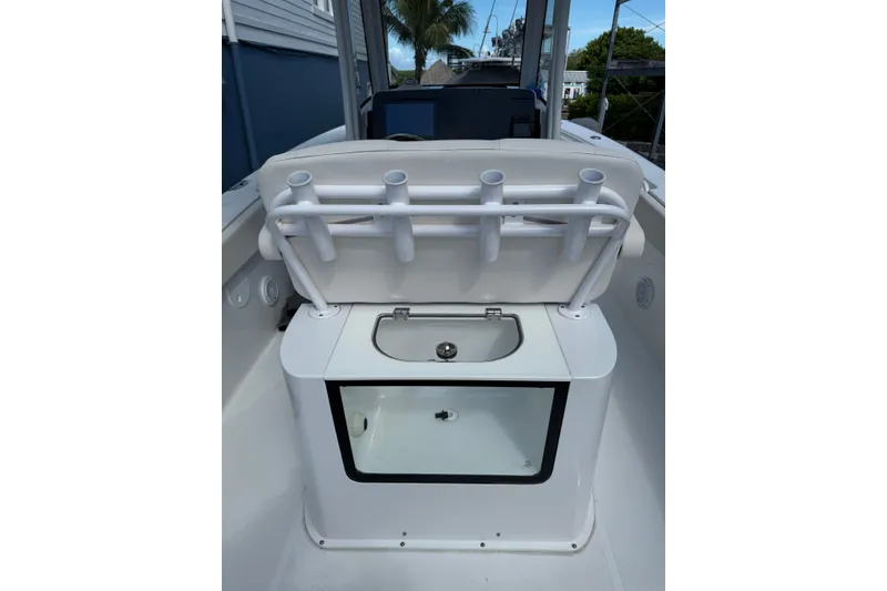 Slide: The Image of 2024 Sea Hunt Gamefish 27 Forward Seating boat interior with rod holders and storage compartment. - 8