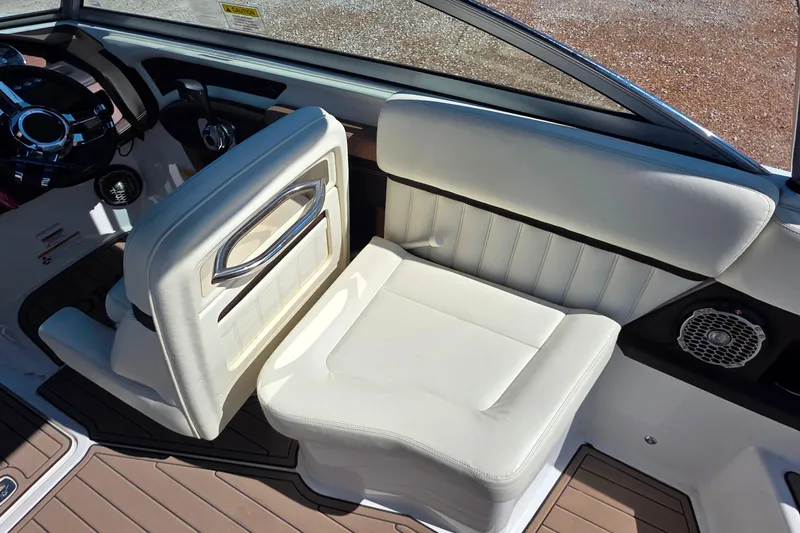Slide: The Image of Interior of a 2013 Cobalt A25 boat with white leather seating. - 11