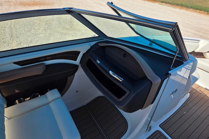 Slide: The Image of Interior of 2013 Cobalt A25 boat with seating and dashboard details. - 14