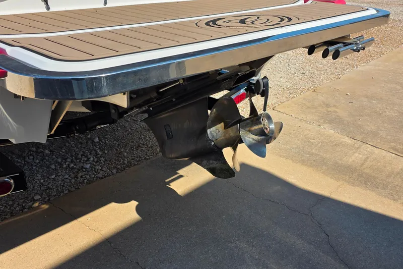 Slide: The Image of Rear view of a 2013 Cobalt A25 boat with propeller and swim platform. - 23