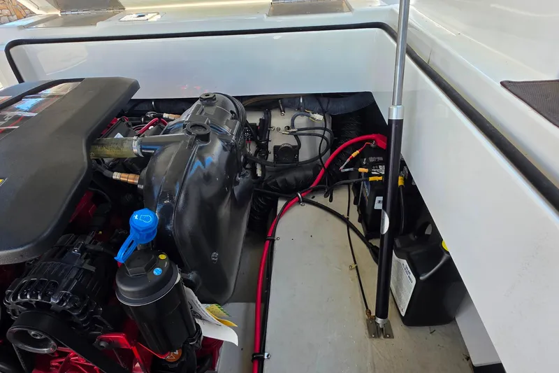 Slide: The Image of Engine compartment of a 2013 Cobalt A25 boat, showing engine and wiring. - 27