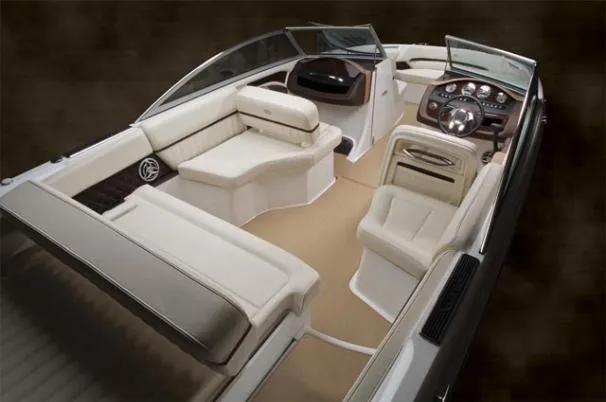 Slide: The Image of 2013 Cobalt A25 boat on trailer, black and white with red stripe, parked outdoors. - 4