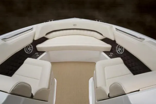 Slide: The Image of 2013 Cobalt A25 boat interior with white leather seating and sleek design. - 5