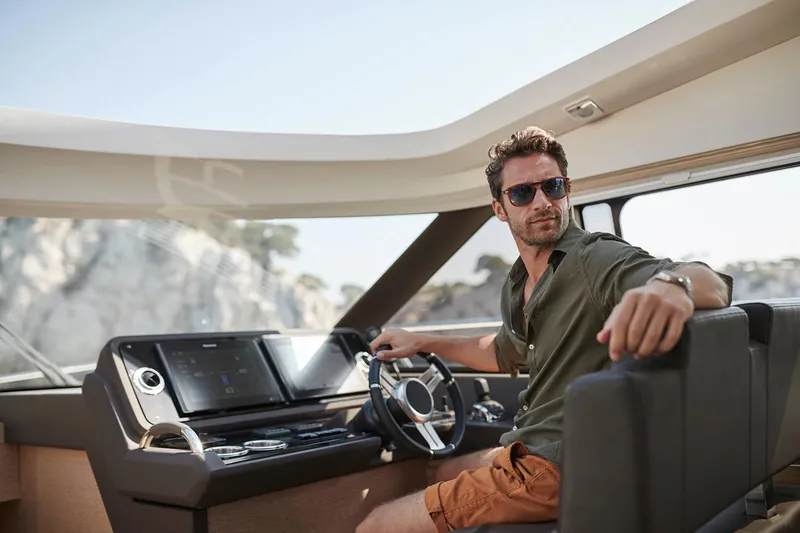 Slide: The Image of Manufacturer Provided Image: Couple relaxing on 2025 Prestige 460 S yacht at sunset. - 11