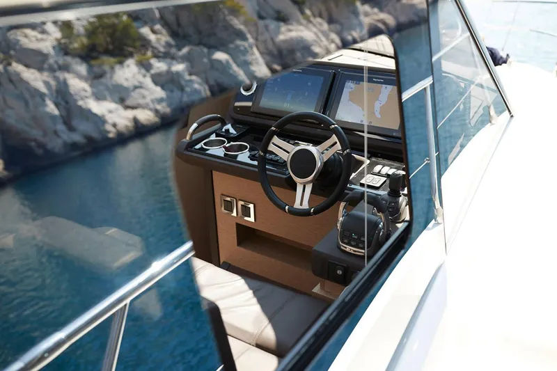 Slide: The Image of Manufacturer Provided Image: Couple relaxing on 2025 Prestige 460 S yacht, enjoying a sunny day at sea. - 12