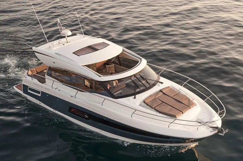 Slide: The Image of Luxury 2025 Prestige 460S yacht cruising on open water. - 6