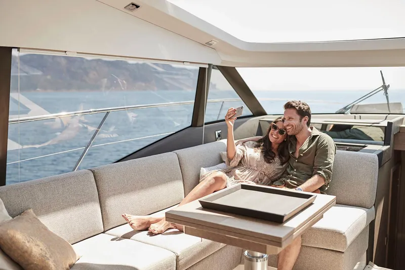 Slide: The Image of Manufacturer Provided Image: Couple relaxing on 2025 Prestige 460 S yacht, enjoying ocean view. - 10