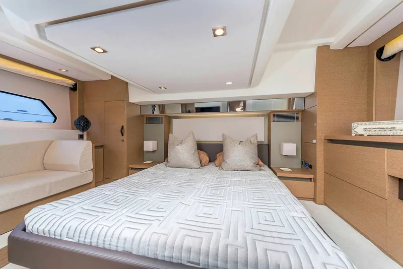 Slide: The Image of Manufacturer Provided Image: Luxurious bedroom interior of 2025 Prestige 460 S yacht, featuring modern design and comfortable bedding. - 18