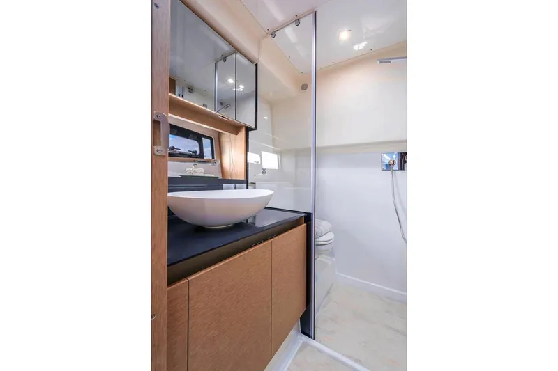 Slide: The Image of Manufacturer Provided Image: Luxurious bathroom interior of 2025 Prestige 460 S yacht, featuring modern sink and shower. - 21