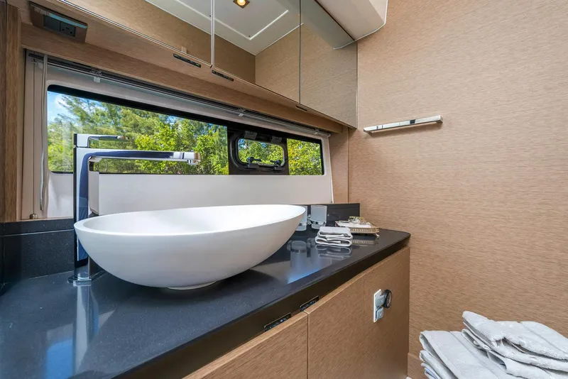Slide: The Image of Manufacturer Provided Image: Luxurious bathroom in 2025 Prestige 460 S yacht with modern sink and sleek design. - 22
