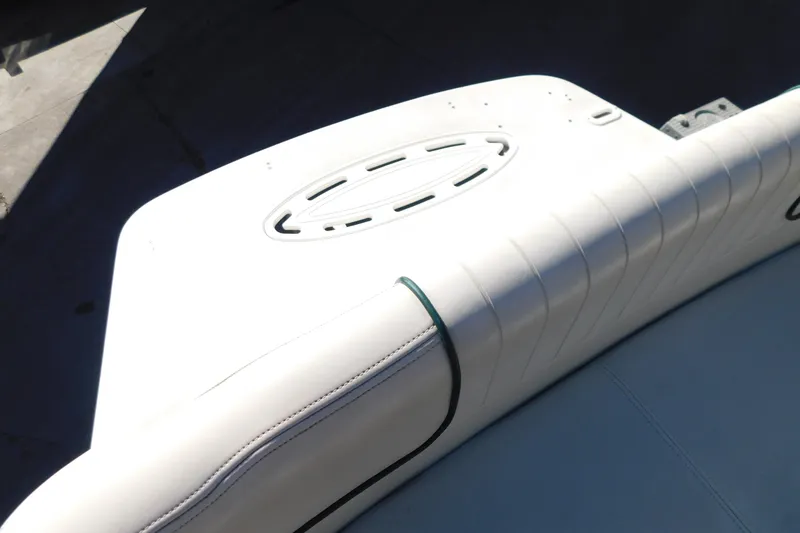 Slide: The Image of 2001 Chaparral Signature 240 boat interior with white cushioned seating. - 12
