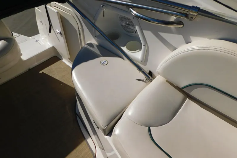 Slide: The Image of 2001 Chaparral Signature 240 boat interior with white seating and stainless steel railings. - 17