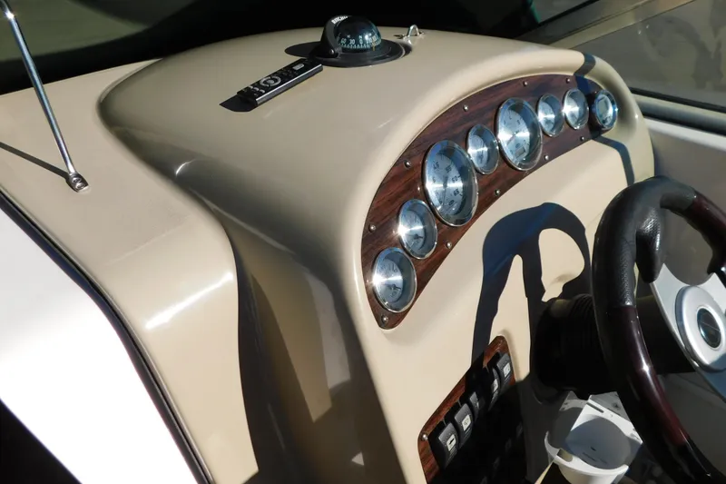 Slide: The Image of Dashboard of a 2001 Chaparral Signature 240 boat with gauges and steering wheel. - 20