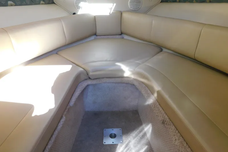 Slide: The Image of Interior of 2001 Chaparral Signature 240 boat with beige seating and carpeted floor. - 22