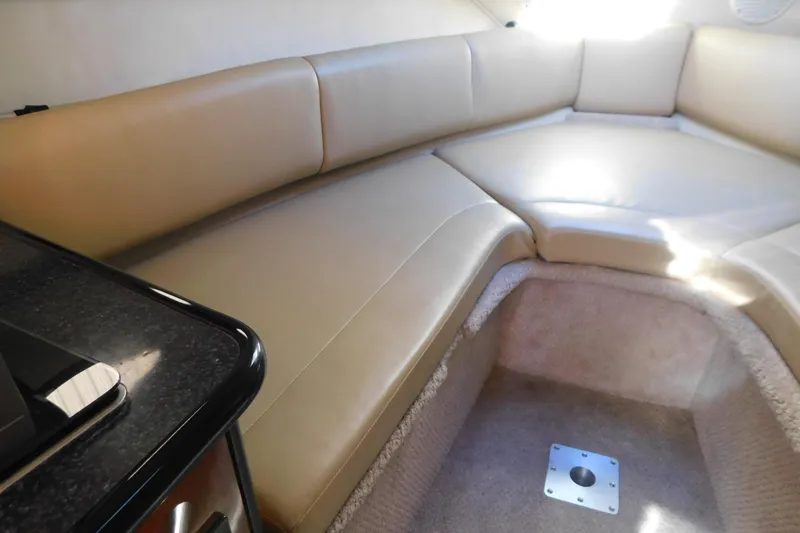 Slide: The Image of Interior of 2001 Chaparral Signature 240 boat with beige seating and carpeted flooring. - 24