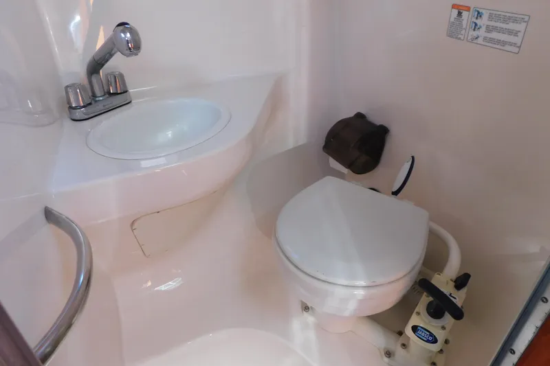 Slide: The Image of 2001 Chaparral Signature 240 boat bathroom with sink and toilet. - 30