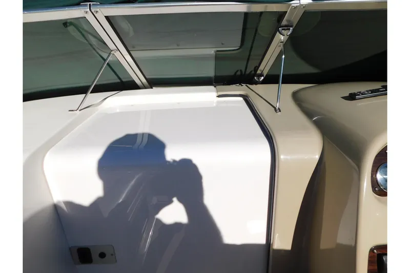 Slide: The Image of 2001 Chaparral Signature 240 boat dashboard with windshield and shadow. - 31