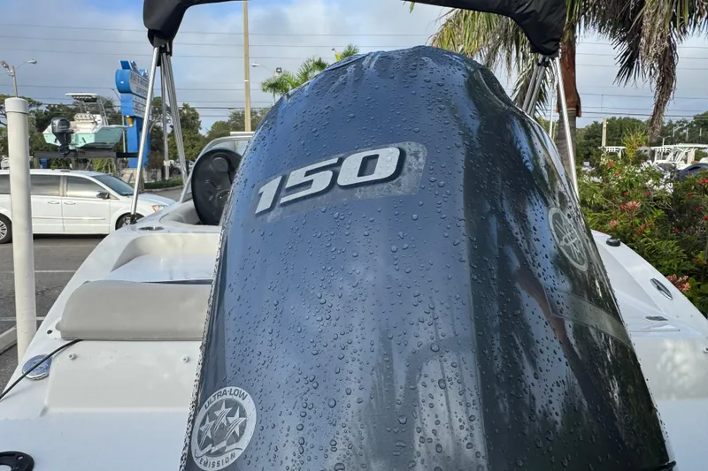 Slide: The Image of 2019 Starcraft MDX 210 OB boat with Yamaha 150 engine, wet with water droplets. - 10