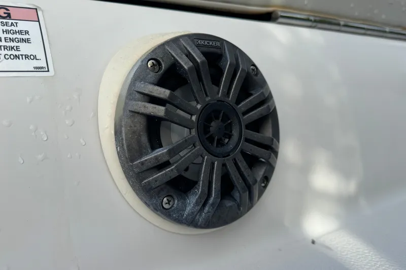 Slide: The Image of Kicker speaker on 2019 Starcraft MDX 210 OB boat, close-up view. - 12