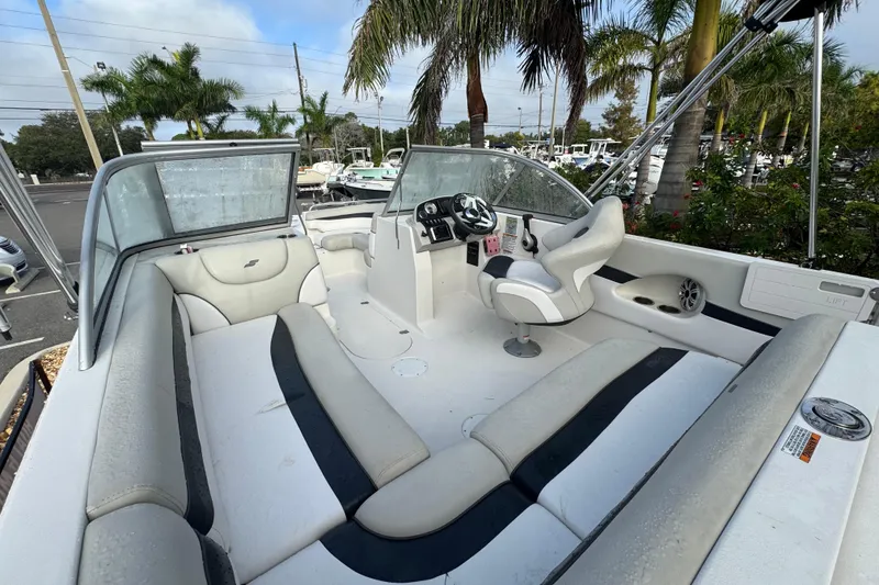 Slide: The Image of 2019 Starcraft MDX 210 OB boat interior with seating, steering wheel, and dashboard. - 15
