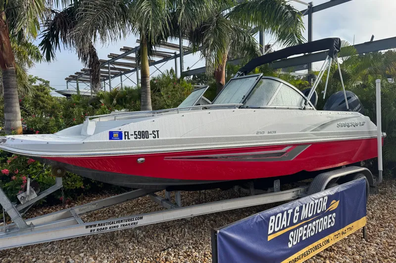 Slide: The Image of 2019 Starcraft MDX 210 OB boat on trailer, displayed at Boat & Motor Superstores. - 2