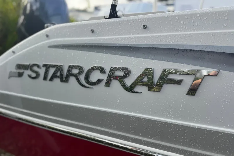 Slide: The Image of 2019 Starcraft MDX 210 OB boat with logo and water droplets on the surface. - 8
