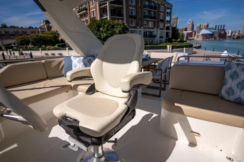 Slide: The Image of Luxurious seating on 2018 Absolute 58 Navetta yacht, docked with cityscape view. - 26