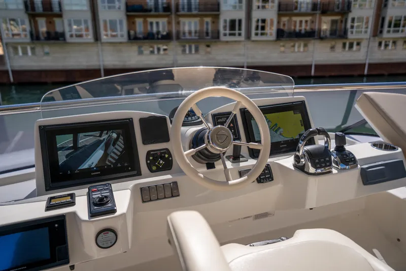 Slide: The Image of Cockpit of 2018 Absolute 58 Navetta yacht with modern navigation equipment and controls. - 27