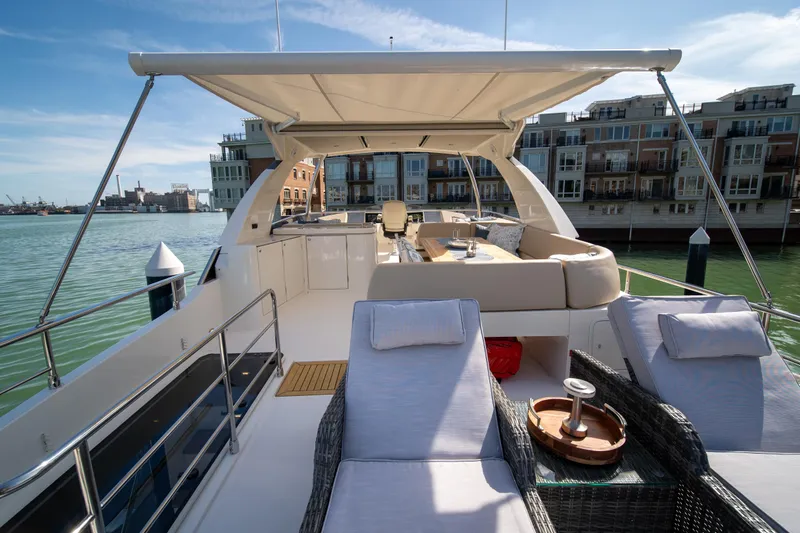 Slide: The Image of Luxurious 2018 Absolute 58 Navetta yacht with spacious deck and waterfront view. - 28