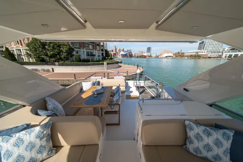 Slide: The Image of Luxurious 2018 Absolute 58 Navetta yacht with elegant seating and waterfront view. - 31