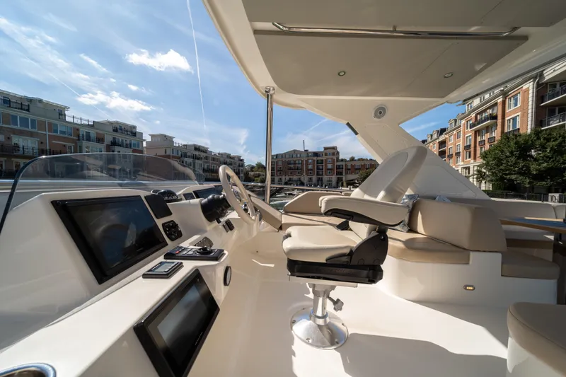 Slide: The Image of Luxurious helm of 2018 Absolute 58 Navetta yacht with modern controls and seating. - 34