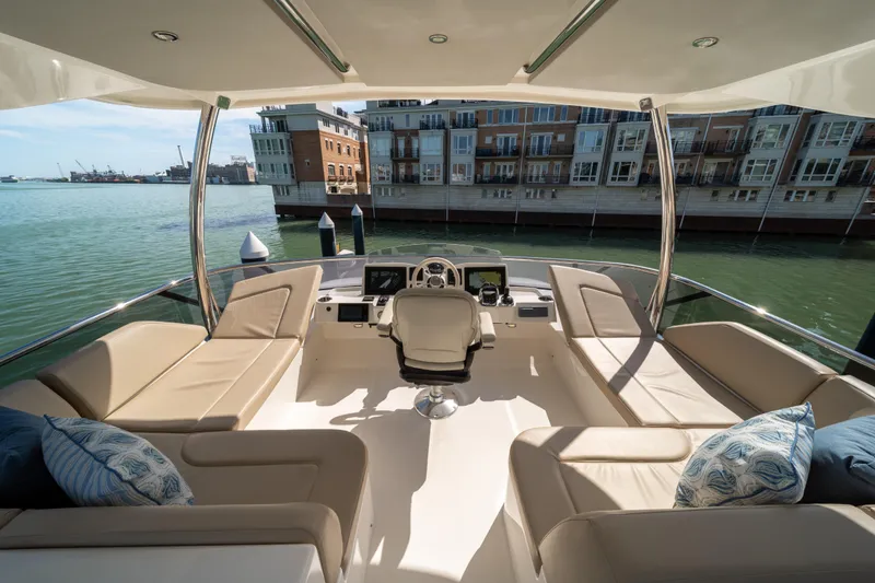 Slide: The Image of Luxurious 2018 Absolute 58 Navetta yacht interior with plush seating and waterfront view. - 37